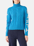 Maglia dolcevita Adler turchese a trecce con jacquard logo